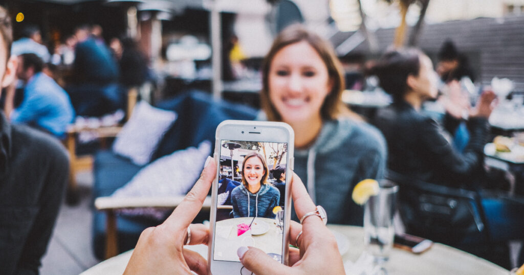 Girl getting her photo taken at a restaurant