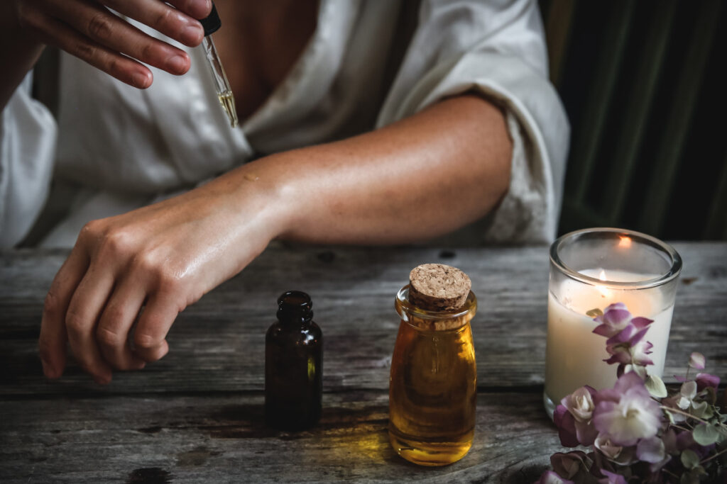 a healing cbd oil is about to drop onto the arm skin