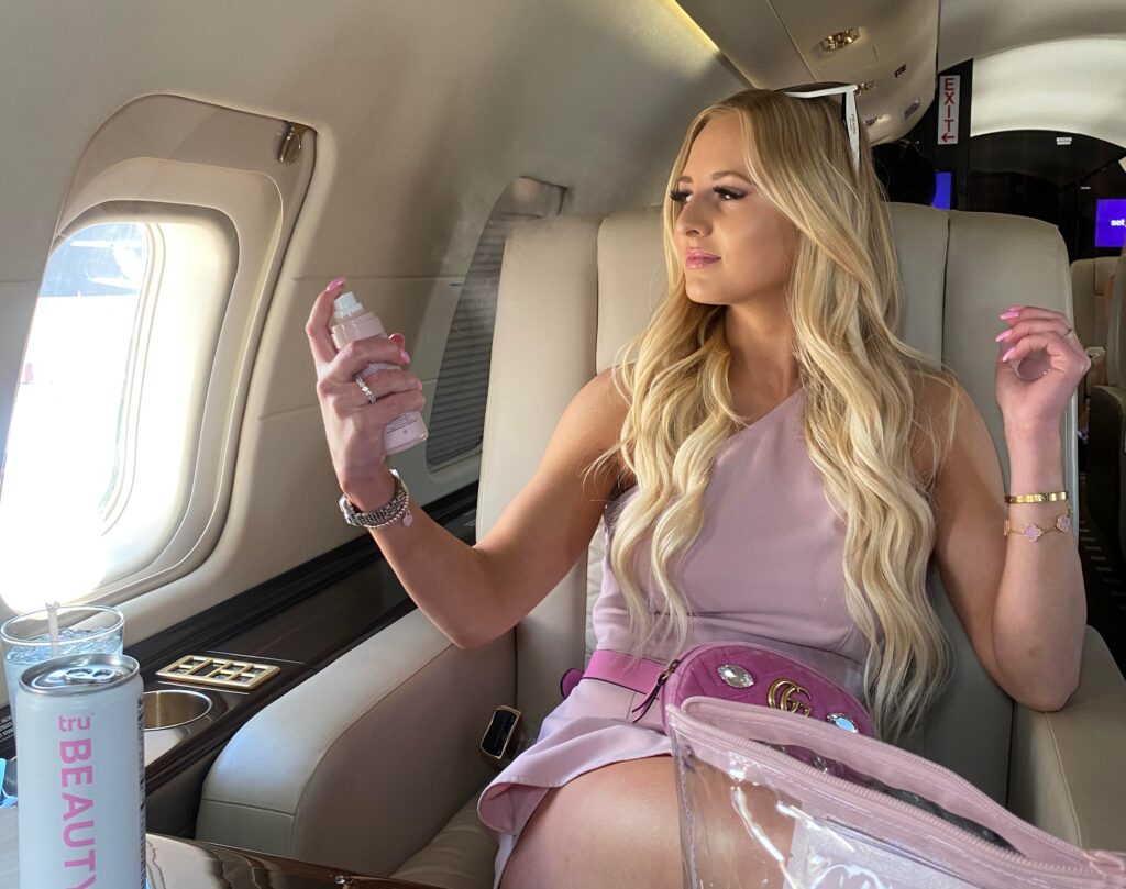 the blondie beauty podcast founder and blonde pr founder mackenzie judge on a private set jet plane wearing all pink